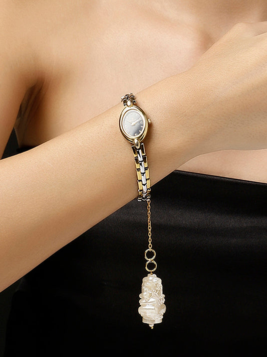 Gold and White Ganpathi Watch Charm from Dugristyle Ruhaniyat By Dugran